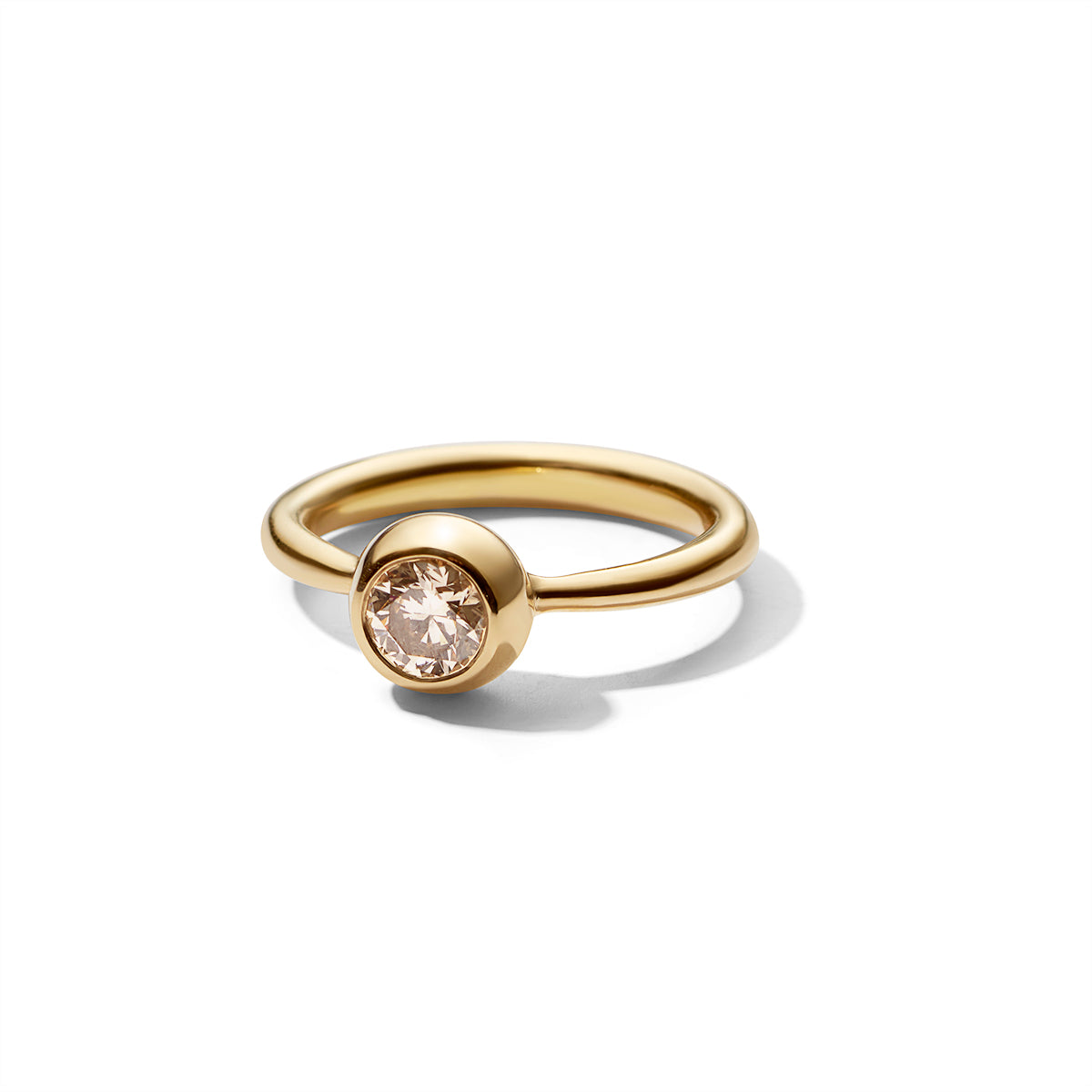 Ring in progression with large champagne diamond, chunky